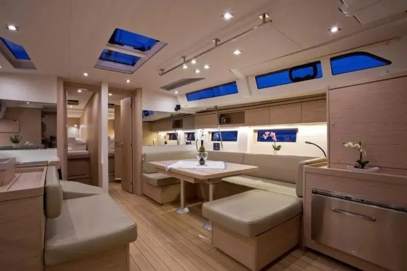 Miss Alice Yacht Photos Pics Luxurious interior of 2018 Beneteau 51.1 yacht with modern furnishings and ambient lighting.