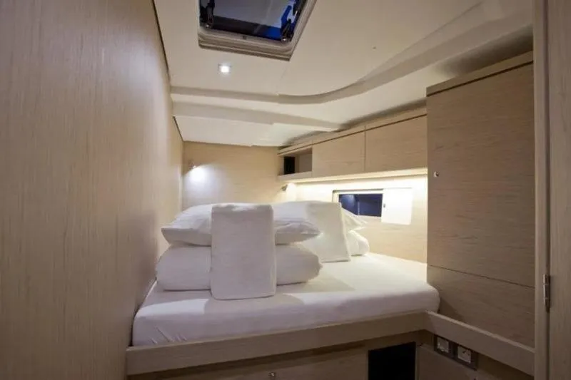 Miss Alice Yacht Photos Pics Luxurious cabin interior of 2018 Beneteau 51.1 yacht with modern design and cozy bedding.