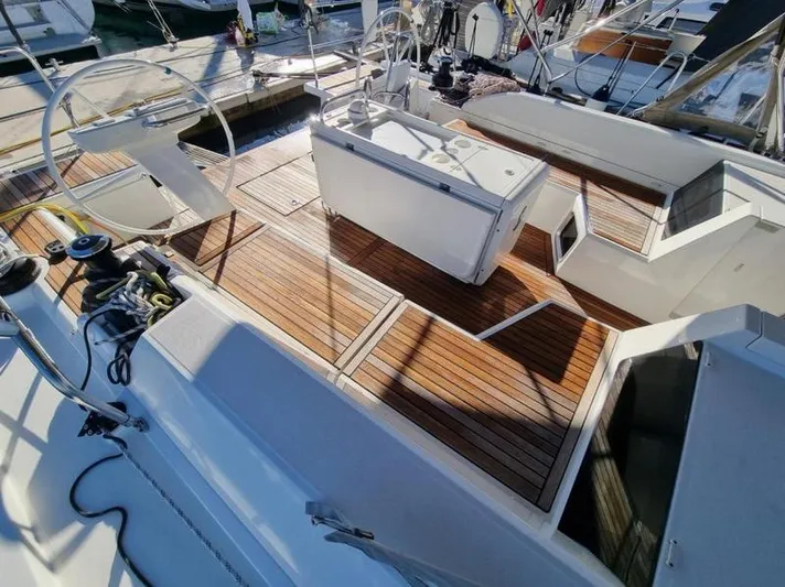 Miss Alice Yacht Photos Pics 2018 Beneteau 51.1 yacht deck with wooden flooring and steering wheels.