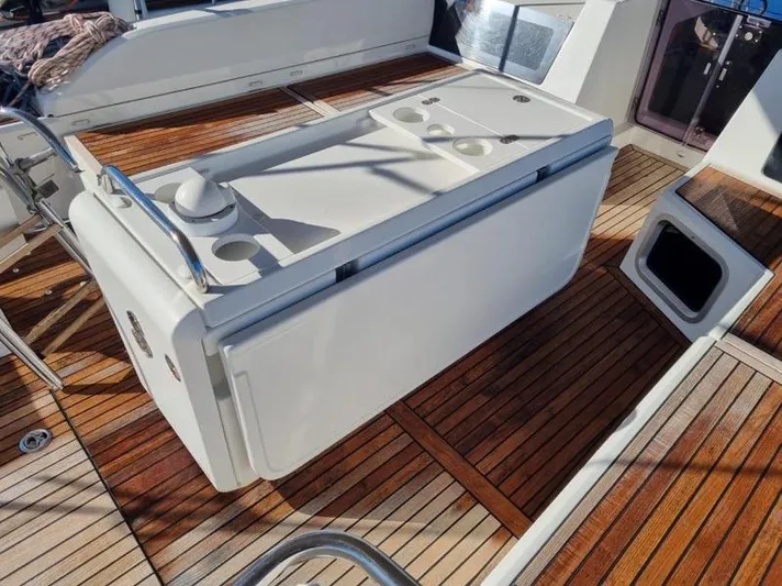 Miss Alice Yacht Photos Pics Beneteau 51.1 yacht deck with wooden flooring and a central console, 2018 model.