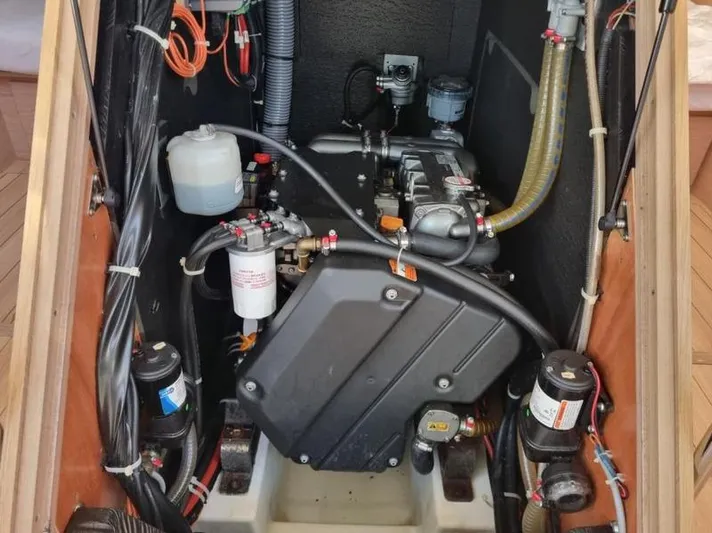 Miss Alice Yacht Photos Pics Engine compartment of a 2018 Beneteau 51.1 sailboat, showcasing mechanical components and wiring.