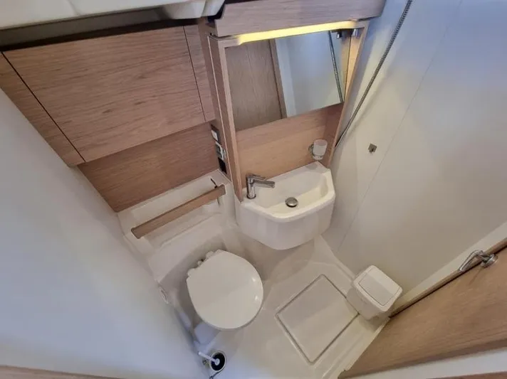 Miss Alice Yacht Photos Pics Modern bathroom in 2018 Beneteau 51.1 yacht with compact design and wooden accents.