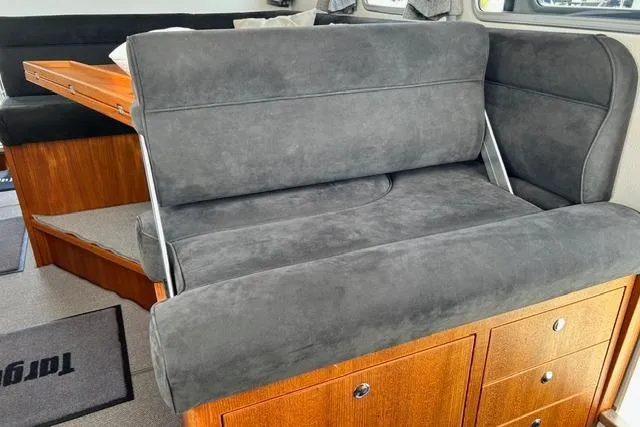 Yacht Photos Pics Interior of 2022 Targa 37 boat with gray seating and wooden cabinetry.