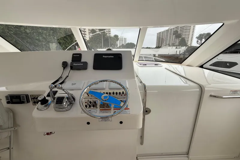  Yacht Photos Pics Helm of 2012 Cabo 40 Hardtop Express with Raymarine electronics and modern controls.