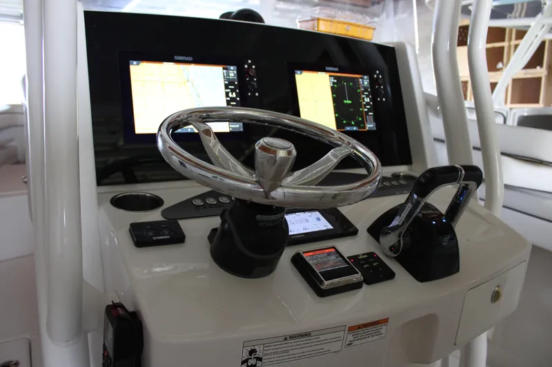  Yacht Photos Pics 2018 Jupiter 30 HFS boat helm with dual Simrad displays and steering wheel.