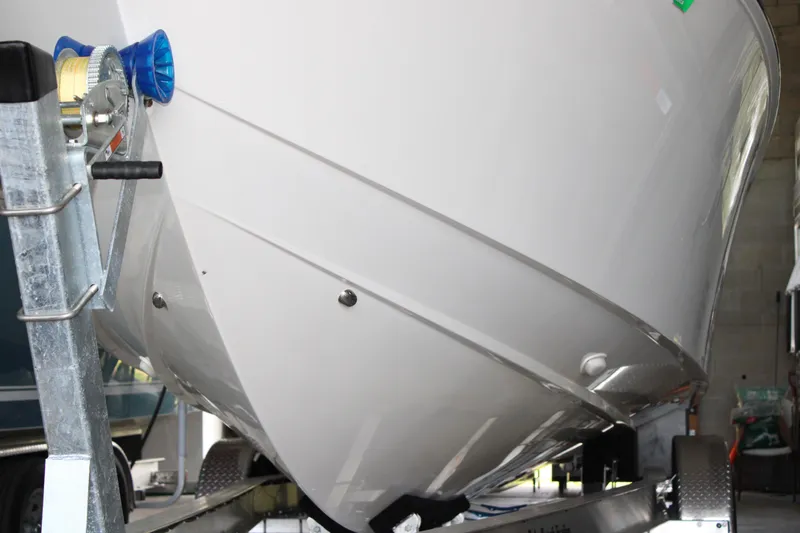  Yacht Photos Pics 2018 Jupiter 30 HFS boat on trailer, close-up of hull and winch.