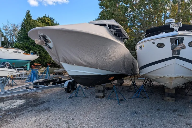  Yacht Photos Pics 2019 Southport 33 FE boat covered and stored on trailer, surrounded by other boats.