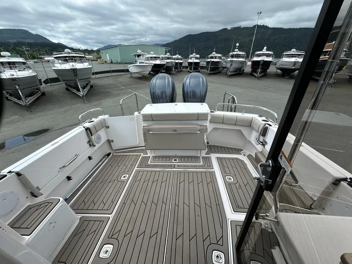  Yacht Photos Pics 2025 Cutwater C-32 CB boat interior with spacious deck and dual engines, docked at marina.