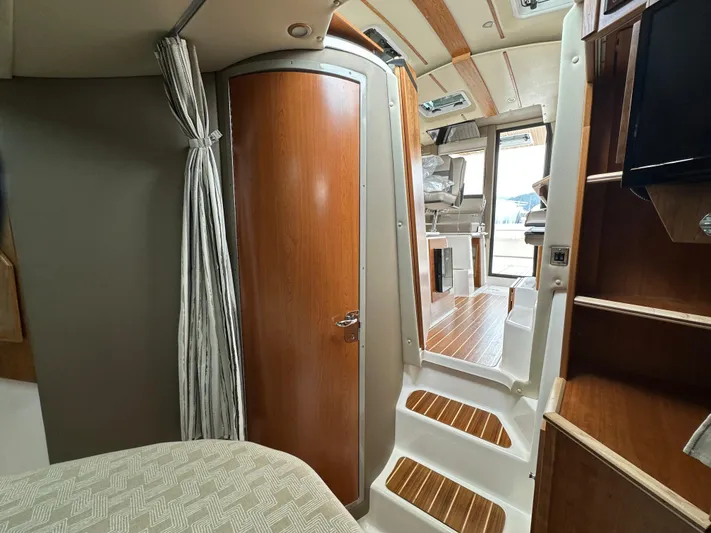  Yacht Photos Pics Interior of 2025 Cutwater C-32 CB boat, featuring wood accents and modern design.