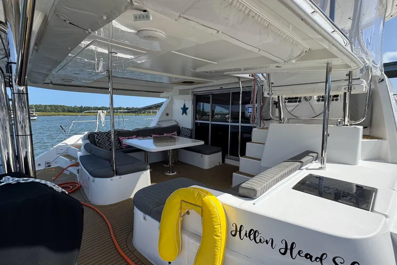  Yacht Photos Pics Luxurious 2014 Leopard 48 yacht with spacious outdoor seating and scenic water view.