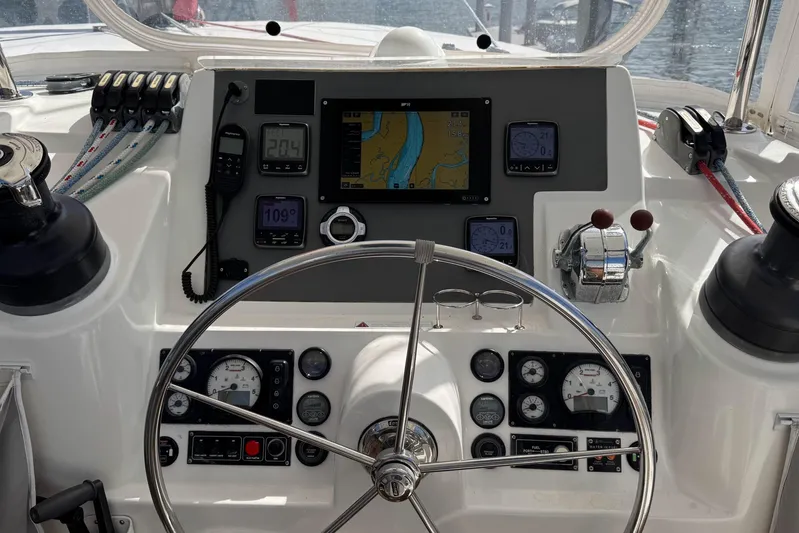  Yacht Photos Pics Helm of 2014 Leopard 48 yacht with navigation instruments and steering wheel.