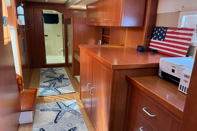  Yacht Photos Pics Luxurious 2014 Leopard 48 yacht interior with wooden cabinetry and American flag decor.