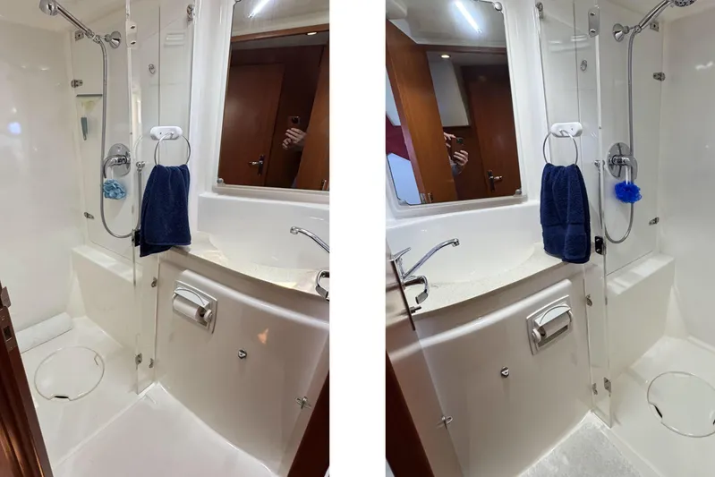  Yacht Photos Pics Modern bathroom in 2014 Leopard 48 yacht, featuring shower, sink, and towel rack.