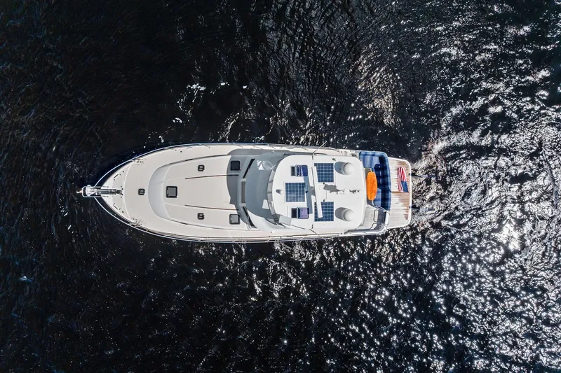 Highlander Yacht Photos Pics Aerial view of 2019 Sabre Flybridge yacht cruising on sparkling water.