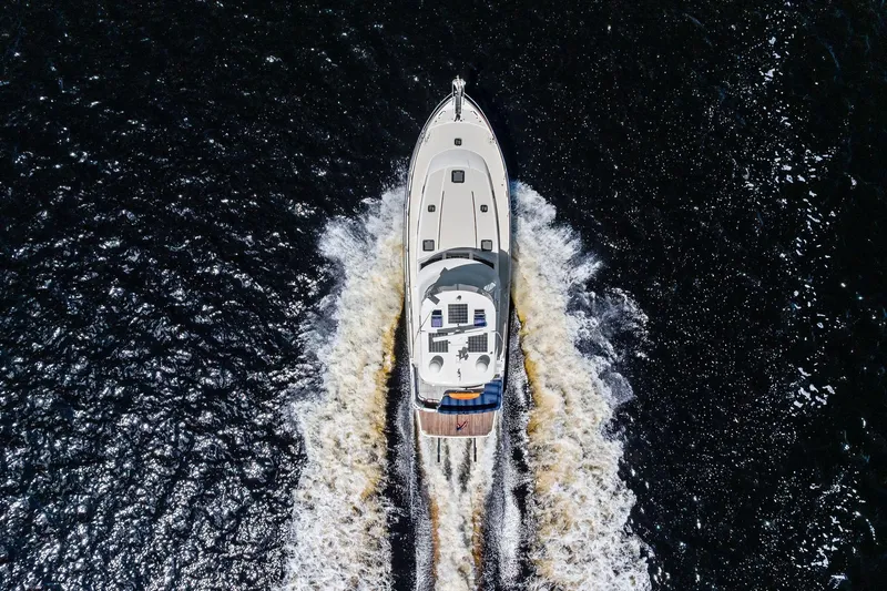 Highlander Yacht Photos Pics Aerial view of 2019 Sabre Flybridge yacht cruising on dark water.