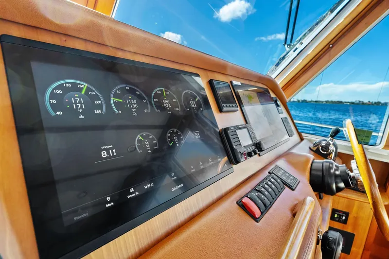 Highlander Yacht Photos Pics 2019 Sabre Flybridge yacht dashboard with digital displays and ocean view.