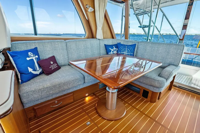 Highlander Yacht Photos Pics Luxurious 2019 Sabre Flybridge yacht interior with elegant seating and nautical-themed decor.