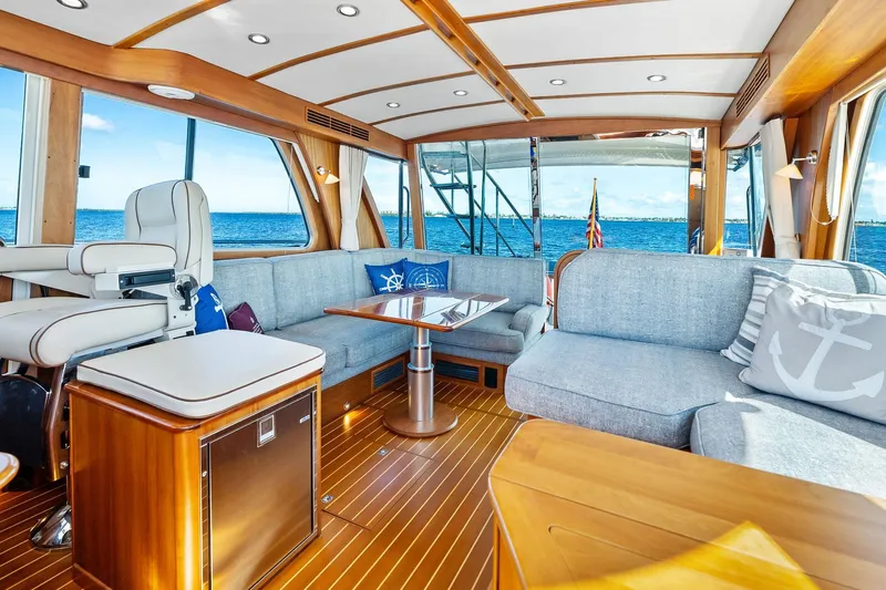 Highlander Yacht Photos Pics Luxurious 2019 Sabre Flybridge yacht interior with elegant seating and ocean view.
