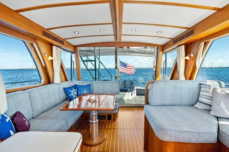 Highlander Yacht Photos Pics Luxurious 2019 Sabre Flybridge yacht interior with elegant wood finish and ocean view.