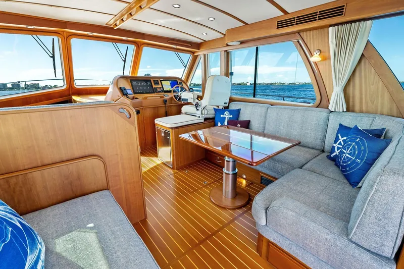 Highlander Yacht Photos Pics Luxurious 2019 Sabre Flybridge yacht interior with elegant wood finish and comfortable seating.
