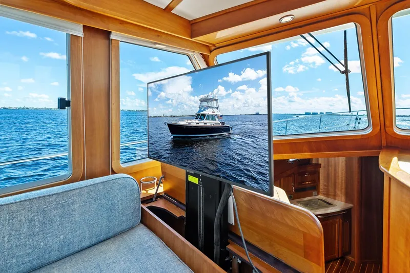 Highlander Yacht Photos Pics Interior of 2019 Sabre Flybridge yacht with ocean view and TV display.