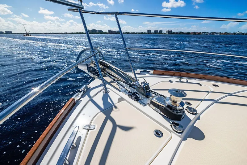 Highlander Yacht Photos Pics 2019 Sabre Flybridge yacht deck with ocean view and clear blue sky.
