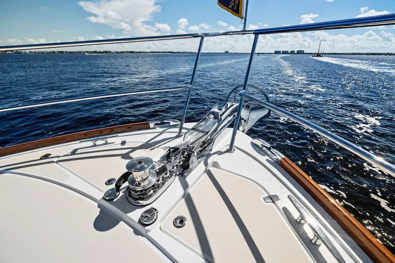 Highlander Yacht Photos Pics 2019 Sabre Flybridge yacht deck with ocean view and clear blue sky.