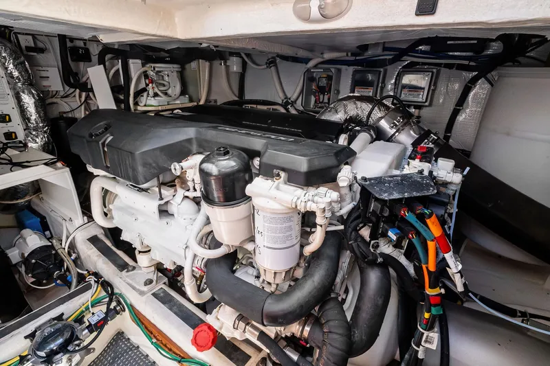 Highlander Yacht Photos Pics Engine room of a 2019 Sabre Flybridge yacht, showcasing complex machinery and wiring.
