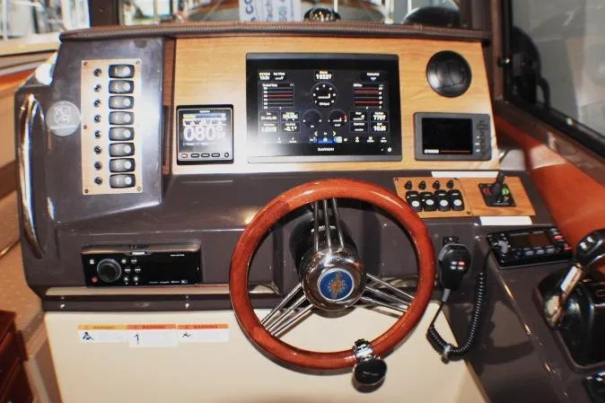 Knot Working Yacht Photos Pics 2020 Ranger Tugs R-27 helm with advanced navigation and control systems.