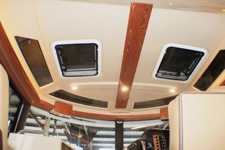 Knot Working Yacht Photos Pics Interior ceiling of 2020 Ranger Tugs R-27 boat with wood accents and skylights.