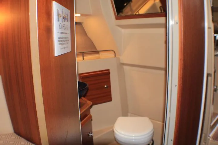 Knot Working Yacht Photos Pics Interior of 2020 Ranger Tugs R-27 boat featuring a compact bathroom.
