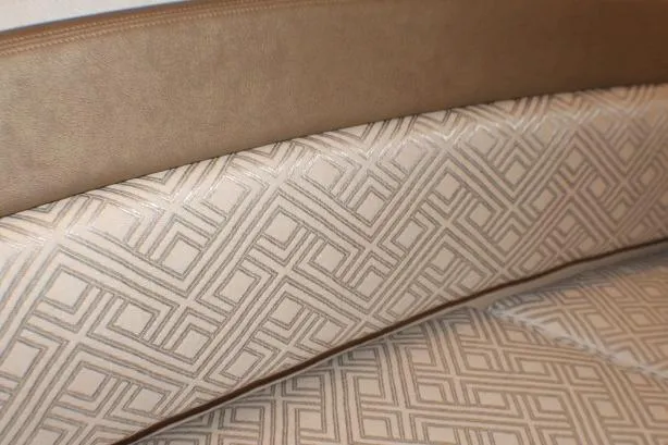 Knot Working Yacht Photos Pics 2020 Ranger Tugs R-27 interior with geometric-patterned upholstery and leather trim.