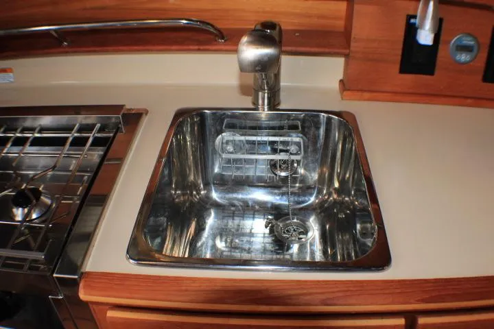 Knot Working Yacht Photos Pics Stainless steel sink in 2020 Ranger Tugs R-27 boat kitchen area.