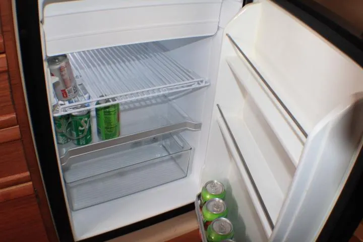 Knot Working Yacht Photos Pics Compact refrigerator inside 2020 Ranger Tugs R-27, stocked with soda cans.