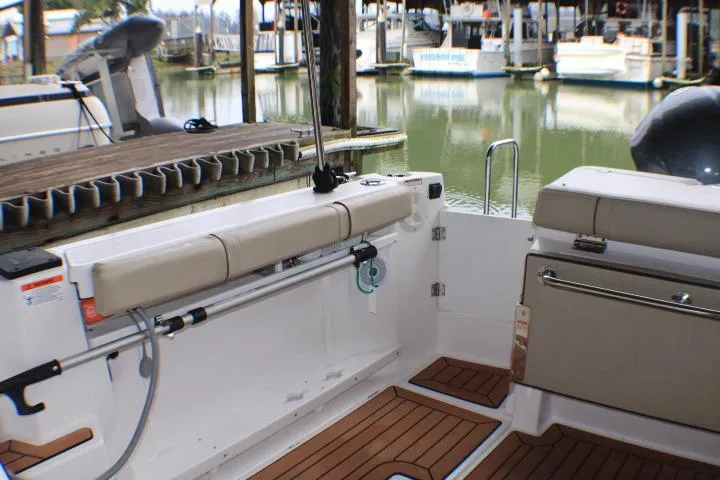 Knot Working Yacht Photos Pics 2020 Ranger Tugs R-27 boat interior with seating and dock view.