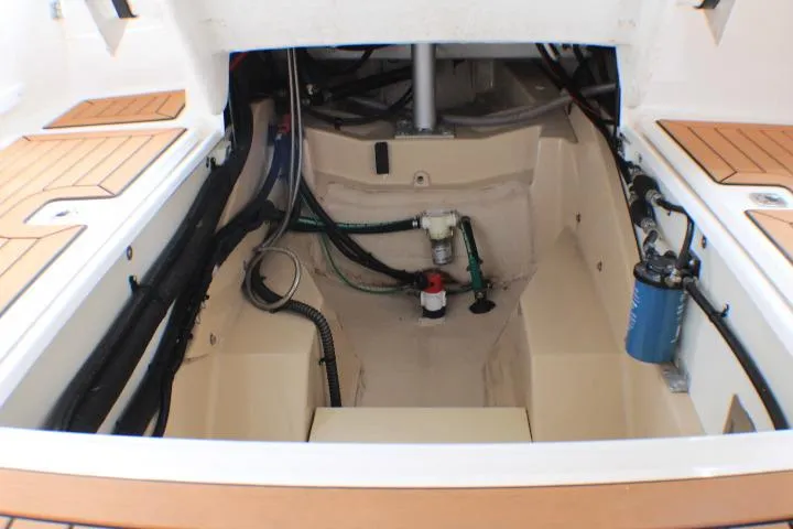 Knot Working Yacht Photos Pics Engine compartment of 2020 Ranger Tugs R-27 boat, showcasing mechanical components and wiring.