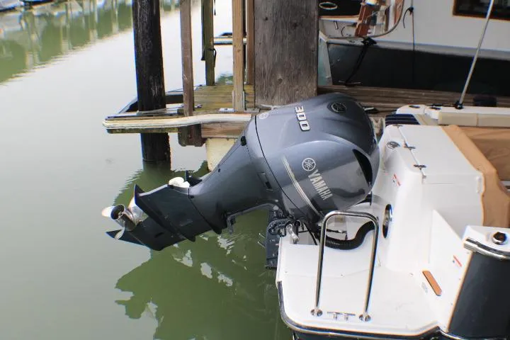 Knot Working Yacht Photos Pics 2020 Ranger Tugs R-27 with Yamaha 300 outboard motor docked at marina.