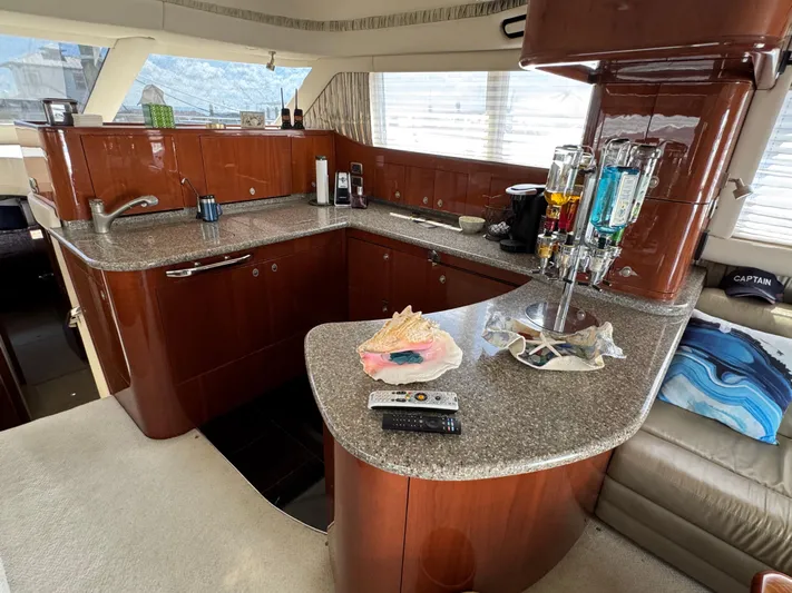 Aqueous Ubiquitous Yacht Photos Pics Luxurious 2004 Sea Ray 560 Sedan Bridge yacht interior with modern kitchen amenities.