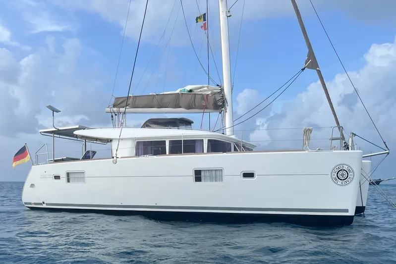  Yacht Photos Pics 2012 Lagoon 400 catamaran sailing on the ocean under a cloudy sky.