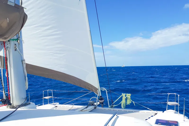  Yacht Photos Pics Sailing on a 2012 Lagoon 400 catamaran in open blue sea under clear skies.