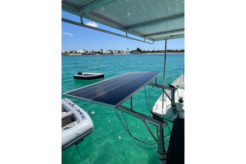 Yacht Photos Pics Solar panel on 2012 Lagoon 400 catamaran, floating in clear turquoise water.