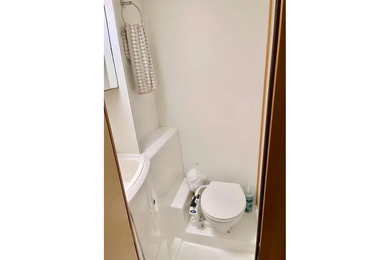  Yacht Photos Pics Compact bathroom in 2012 Lagoon 400 yacht with toilet and towel rack.
