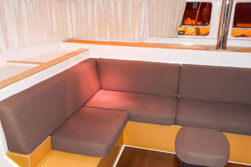  Yacht Photos Pics Interior of 2012 Lagoon 400 yacht with brown seating and curtains.