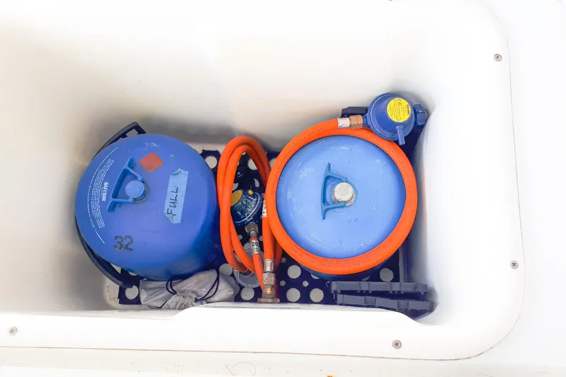  Yacht Photos Pics Blue gas cylinders with orange hoses in Lagoon 400 yacht compartment, 2012 model.