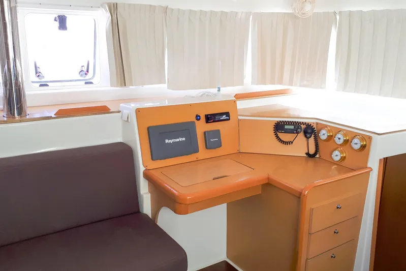 Yacht Photos Pics Interior of 2012 Lagoon 400 yacht with navigation equipment and seating area.