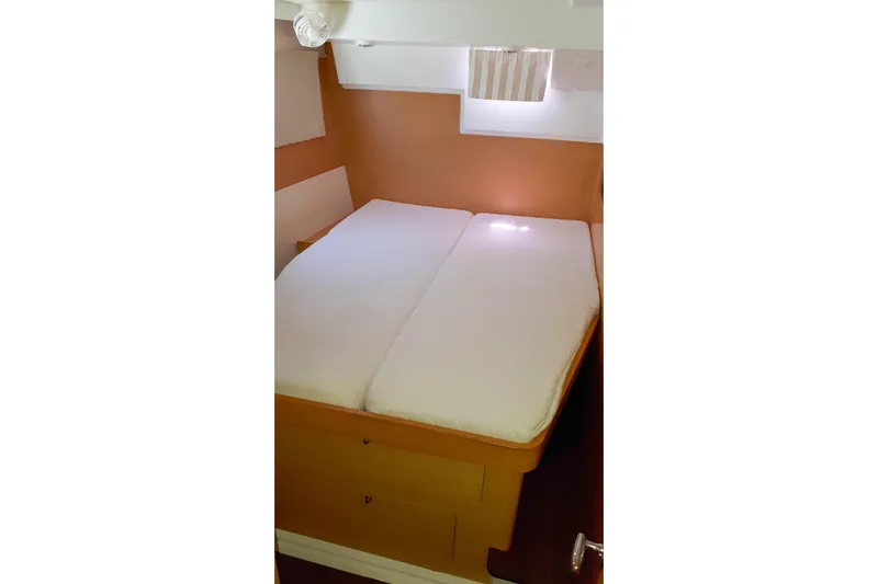  Yacht Photos Pics Cozy cabin interior of 2012 Lagoon 400 catamaran with comfortable bed.