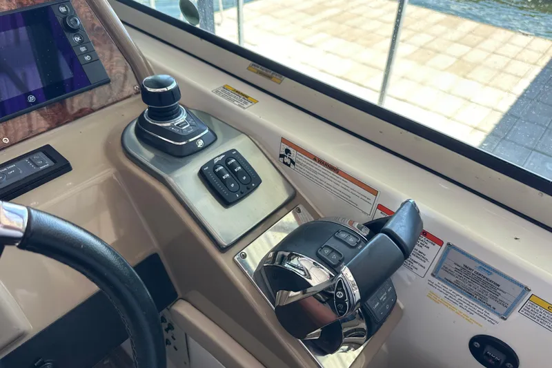  Yacht Photos Pics Control panel of a 2018 Formula 370 Super Sport boat with joystick and throttle.