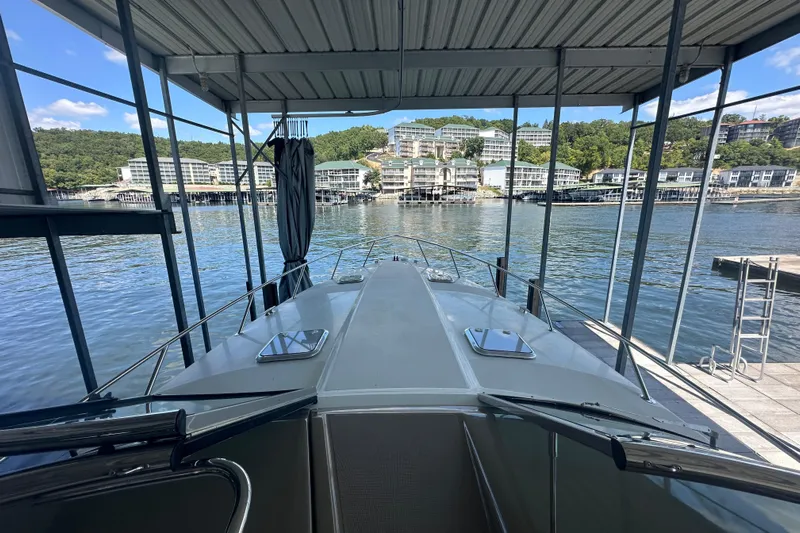  Yacht Photos Pics 2018 Formula 370 Super Sport docked at a scenic marina with waterfront buildings.