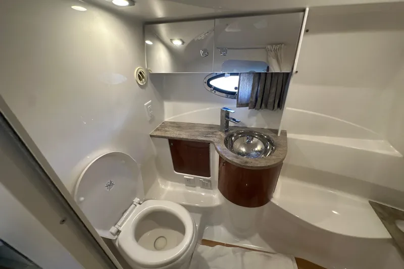  Yacht Photos Pics 2018 Formula 370 Super Sport boat bathroom with modern sink, toilet, and mirror.