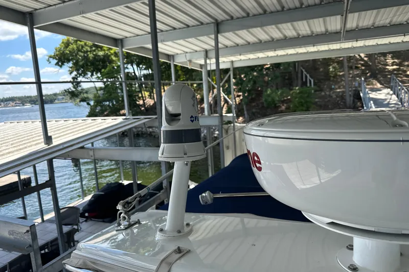 Yacht Photos Pics 2018 Formula 370 Super Sport boat docked under a covered marina with scenic lake view.